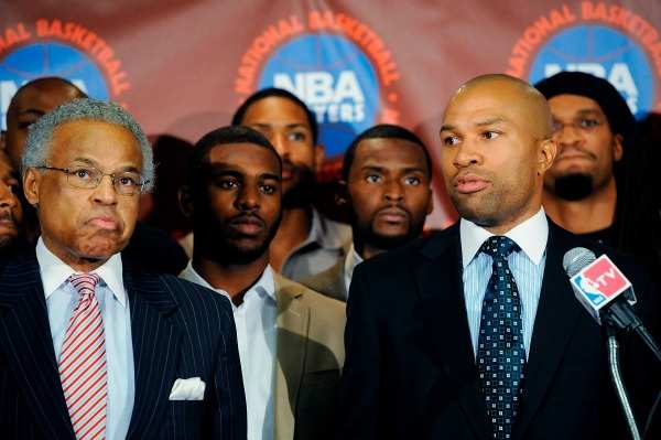 Derek Fisher (right) was among NBPA members who voted executive director Billy Hunter out of office. (Patrick McDermott/Getty Images)